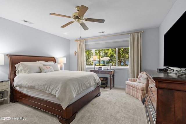 111 Mcginnis Dr, Pine Knoll Shores, NC 28512 - bedroom with light colored carpet and a ceiling fan