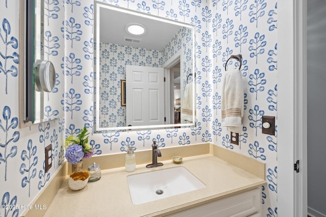 111 Mcginnis Dr, Pine Knoll Shores, NC 28512 - bathroom with wallpapered walls and vanity