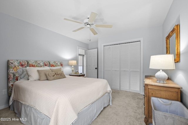 111 Mcginnis Dr, Pine Knoll Shores, NC 28512 - bedroom with light colored carpet, a closet, and ceiling fan
