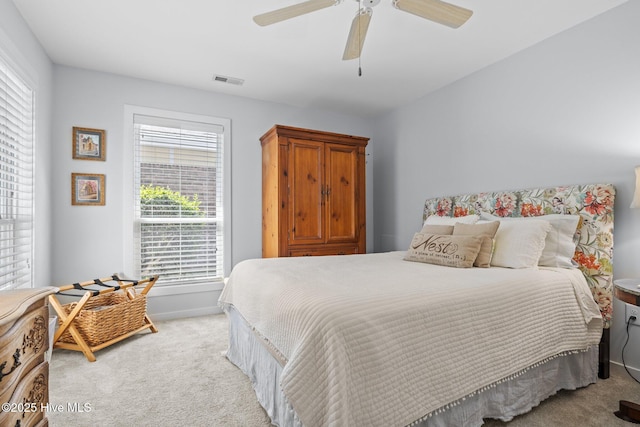 111 Mcginnis Dr, Pine Knoll Shores, NC 28512 - bedroom with light colored carpet and a ceiling fan