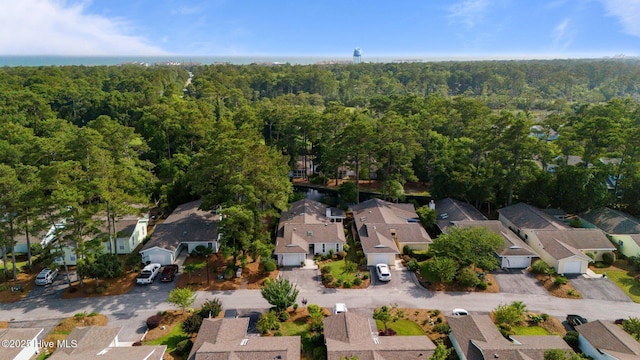 111 Mcginnis Dr, Pine Knoll Shores, NC 28512 - aerial view of property and surrounding area featuring a heavily wooded area and nearby suburban area
