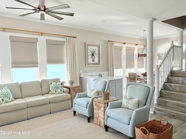 23 Leland St, Ocean Isle Beach, NC 28469 - living area with decorative columns, ornamental molding, stairway, and a ceiling fan