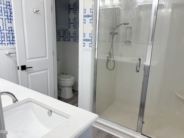 23 Leland St, Ocean Isle Beach, NC 28469 - full bath with a stall shower, vanity, and wood finished floors