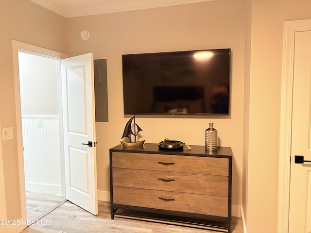 23 Leland St, Ocean Isle Beach, NC 28469 - detailed view of electric panel, wood finished floors, ornamental molding, and a smoke detector
