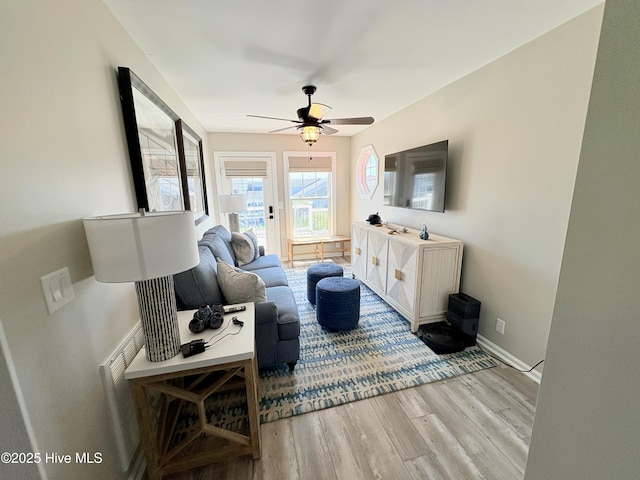 23 Leland St, Ocean Isle Beach, NC 28469 - living area featuring light wood-style flooring and ceiling fan