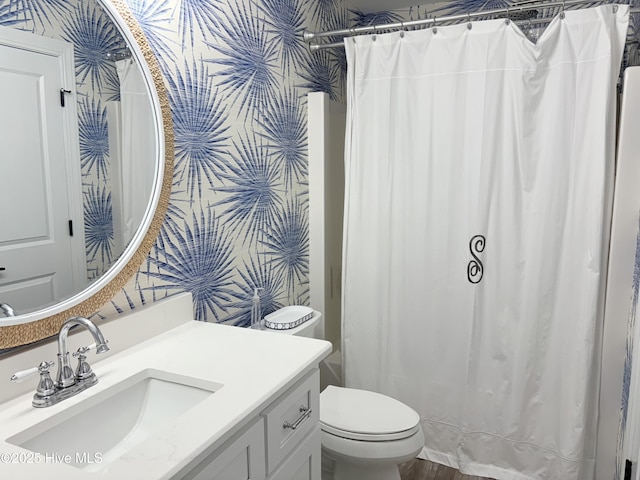 23 Leland St, Ocean Isle Beach, NC 28469 - bathroom with vanity, wallpapered walls, and a shower with curtain