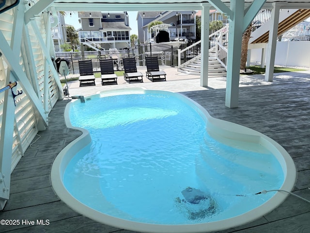 23 Leland St, Ocean Isle Beach, NC 28469 - view of swimming pool featuring stairway and a patio