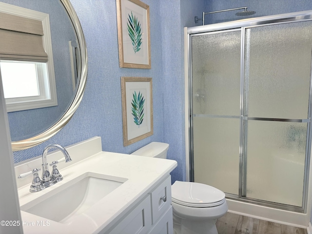 23 Leland St, Ocean Isle Beach, NC 28469 - full bathroom featuring a stall shower, vanity, wood finished floors, and a textured wall
