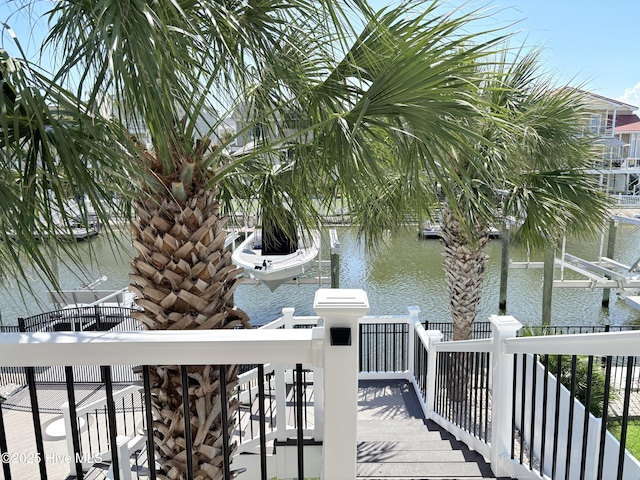 23 Leland St, Ocean Isle Beach, NC 28469 - dock featuring a water view and boat lift