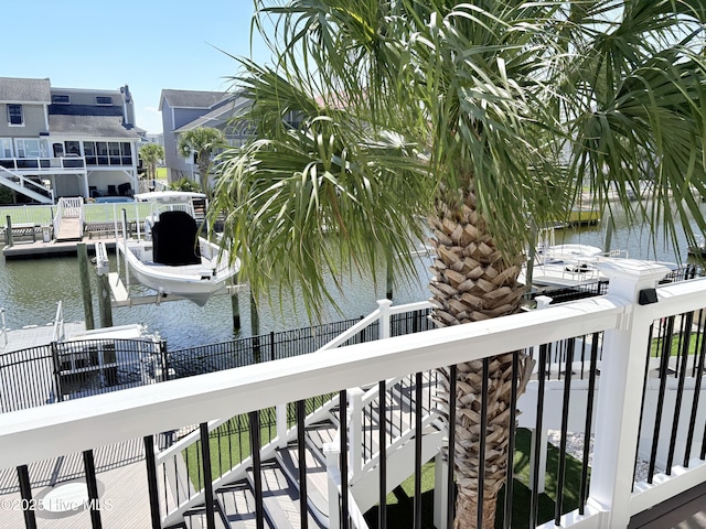 23 Leland St, Ocean Isle Beach, NC 28469 - balcony featuring a water view and a dock
