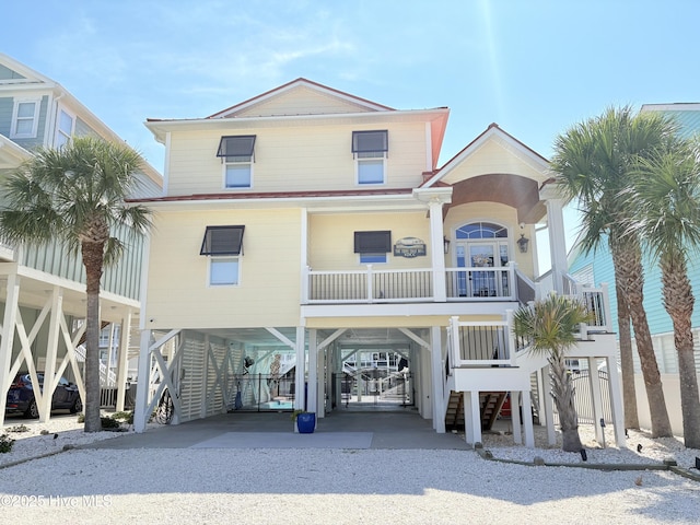 23 Leland St, Ocean Isle Beach, NC 28469 - beach home featuring a carport, driveway, and stairway