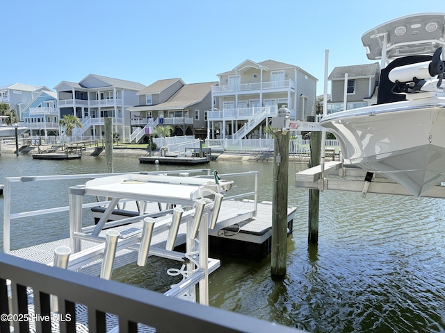 23 Leland St, Ocean Isle Beach, NC 28469 - dock area featuring a water view and boat lift
