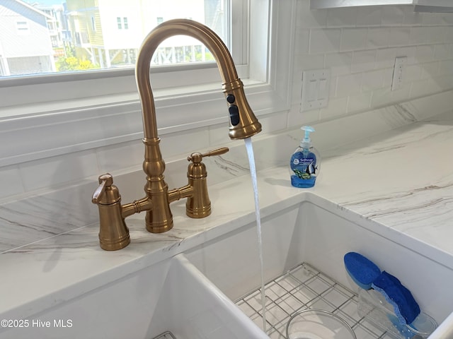 23 Leland St, Ocean Isle Beach, NC 28469 - kitchen view of a sink and tasteful backsplash