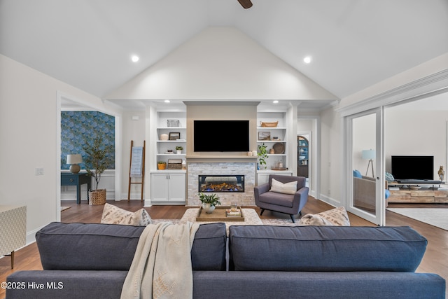 3478 Belle Meade Way NE, Leland, NC 28451 - living room with vaulted ceiling, a fireplace, wood finished floors, ceiling fan, and built in shelves