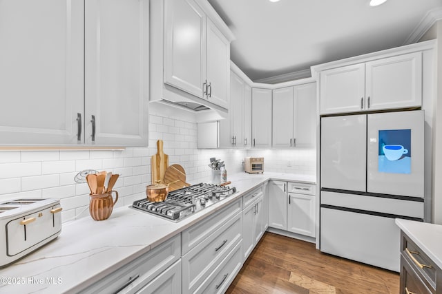 3478 Belle Meade Way NE, Leland, NC 28451 - kitchen featuring freestanding refrigerator, stainless steel gas stovetop, white cabinetry, light stone counters, and dark wood-type flooring