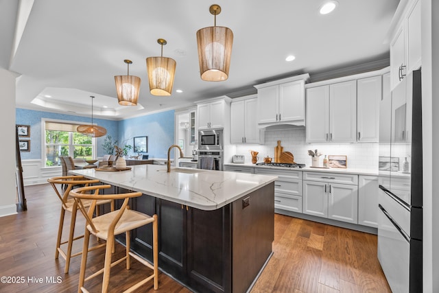 3478 Belle Meade Way NE, Leland, NC 28451 - kitchen with appliances with stainless steel finishes, recessed lighting, white cabinetry, backsplash, and an island with sink