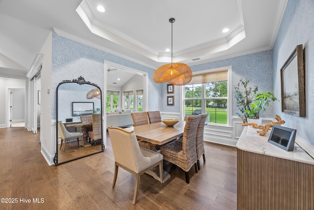 3478 Belle Meade Way NE, Leland, NC 28451 - dining area with wallpapered walls, dark wood-style floors, crown molding, lofted ceiling, and a tray ceiling