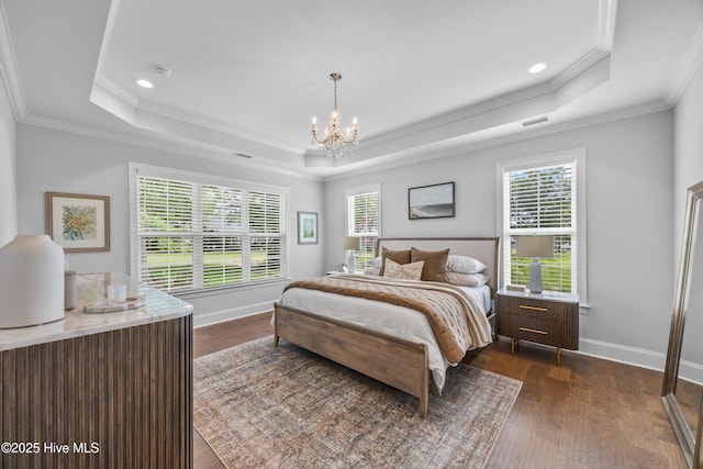 3478 Belle Meade Way NE, Leland, NC 28451 - bedroom with a raised ceiling, ornamental molding, dark wood-style floors, a chandelier, and recessed lighting