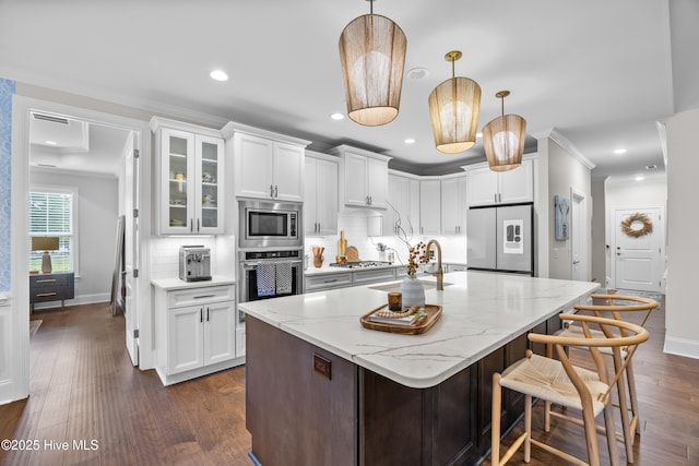 3478 Belle Meade Way NE, Leland, NC 28451 - kitchen with stainless steel appliances, white cabinetry, decorative backsplash, light stone countertops, and recessed lighting