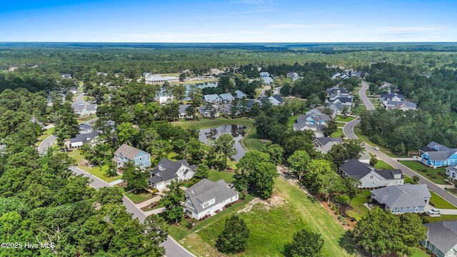 3478 Belle Meade Way NE, Leland, NC 28451 - aerial perspective of suburban area featuring a forest and a large body of water