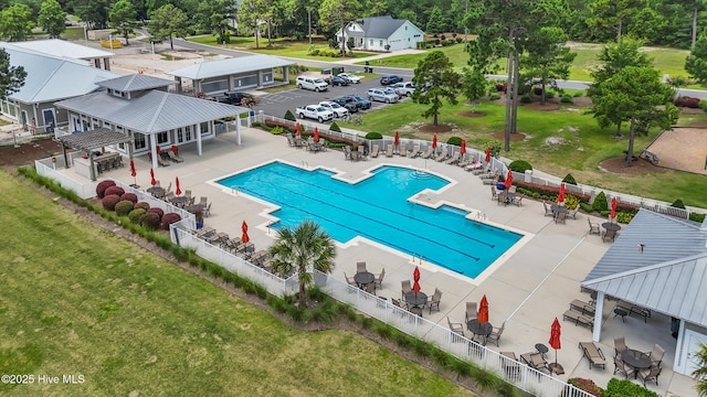 3478 Belle Meade Way NE, Leland, NC 28451 - community pool with a patio area, view of scattered trees, and outdoor dining area
