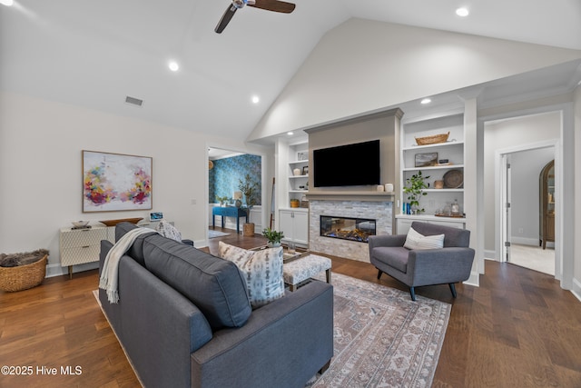 3478 Belle Meade Way NE, Leland, NC 28451 - living area featuring a stone fireplace, a ceiling fan, high vaulted ceiling, recessed lighting, and built in shelves