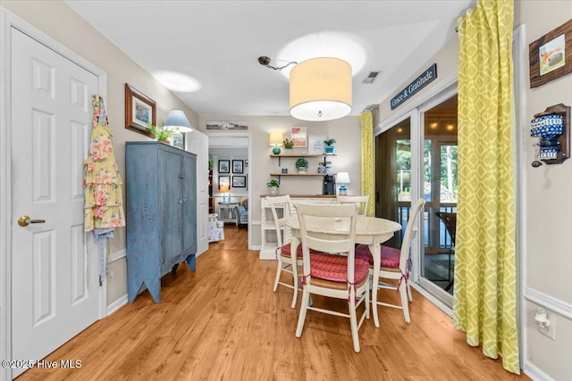 1484 Rays Bridge Rd, Whispering Pines, NC 28327 - dining space with wood finished floors and french doors