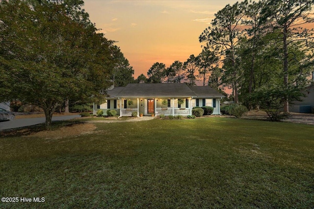 1484 Rays Bridge Rd, Whispering Pines, NC 28327 - ranch-style home featuring a porch and a yard