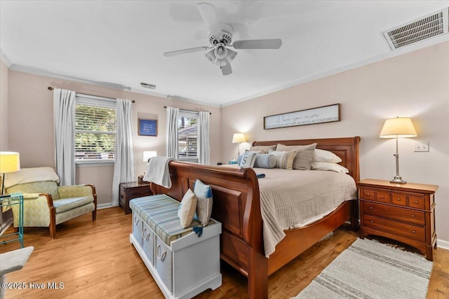 1484 Rays Bridge Rd, Whispering Pines, NC 28327 - bedroom featuring crown molding, light wood-style floors, and ceiling fan