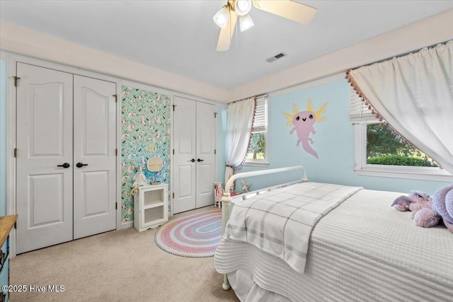 1484 Rays Bridge Rd, Whispering Pines, NC 28327 - bedroom with two closets, carpet, and a ceiling fan