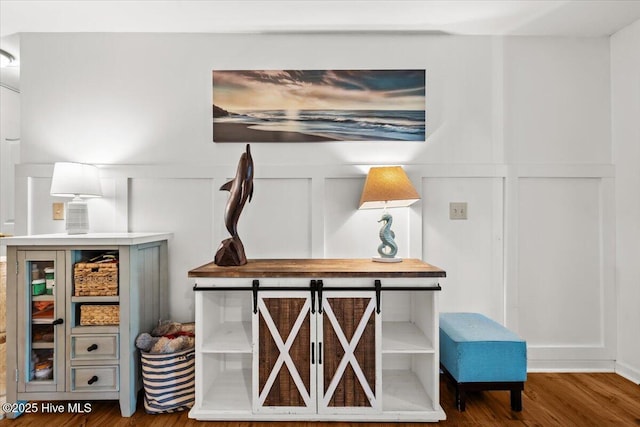 1484 Rays Bridge Rd, Whispering Pines, NC 28327 - detailed view of a decorative wall, wood finished floors, and a wainscoted wall