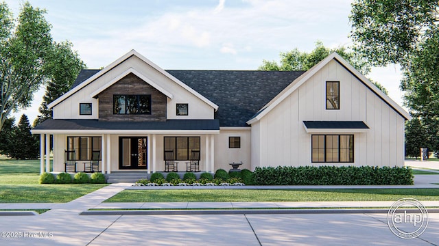 108 Firefly Dr, Wallace, NC 28466 - modern farmhouse featuring a front yard, covered porch, a shingled roof, and board and batten siding