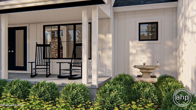 108 Firefly Dr, Wallace, NC 28466 - view of exterior entry with board and batten siding and roof with shingles