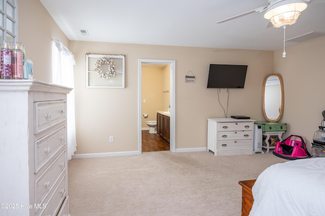 337 Brewington Rd, Clinton, NC 28328 - bedroom with carpet, connected bathroom, and ceiling fan