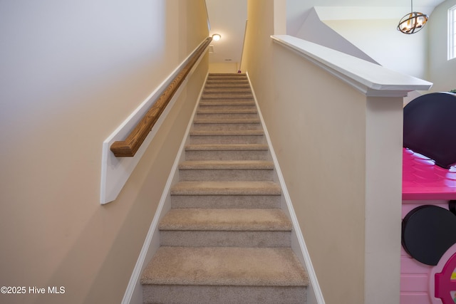 337 Brewington Rd, Clinton, NC 28328 - staircase featuring carpet and a chandelier
