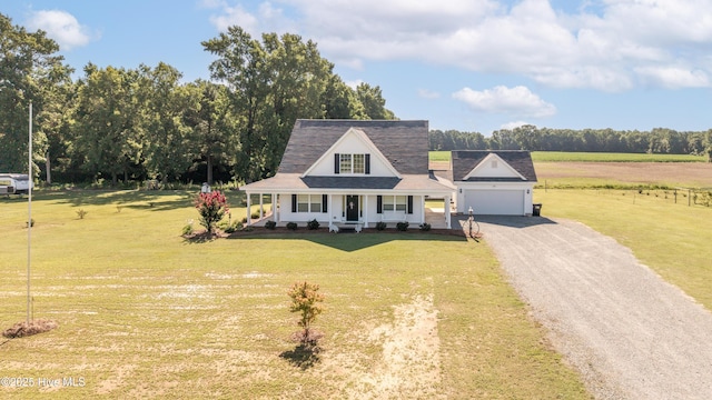 337 Brewington Rd, Clinton, NC 28328 - view of front of home with a porch, gravel driveway, a front lawn, and a garage