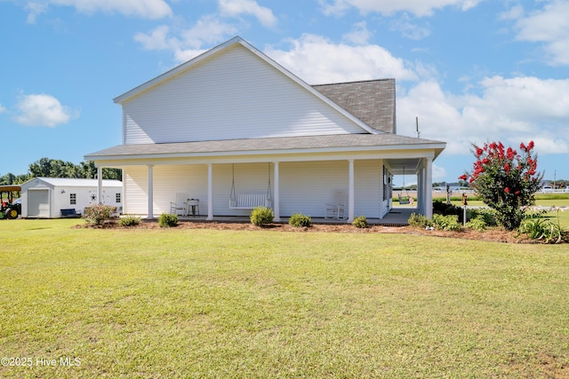 337 Brewington Rd, Clinton, NC 28328 - rear view of property featuring a porch, a lawn, and a shingled roof