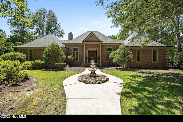 7006 Club House Dr, New Bern, NC 28562 - view of front facade featuring crawl space, brick siding, a front yard, and a chimney