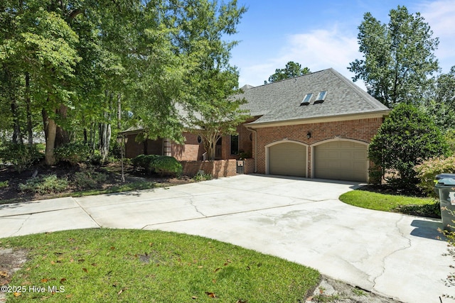 7006 Club House Dr, New Bern, NC 28562 - view of front of home featuring a garage, concrete driveway, brick siding, and a shingled roof