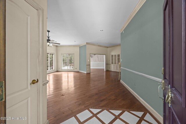 7006 Club House Dr, New Bern, NC 28562 - unfurnished room featuring ornamental molding, a ceiling fan, and wood finished floors