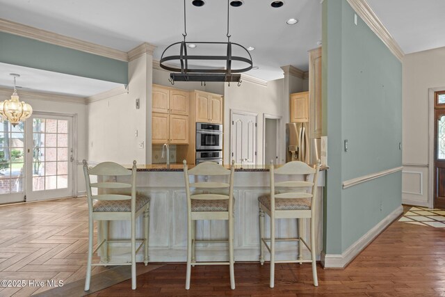 7006 Club House Dr, New Bern, NC 28562 - unfurnished dining area featuring a chandelier, wood finished floors, and ornamental molding
