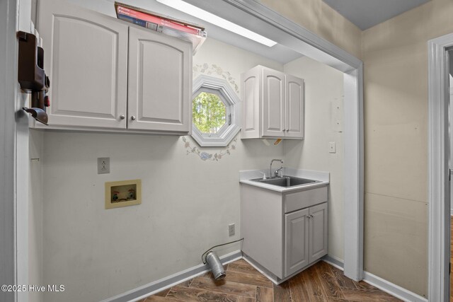 7006 Club House Dr, New Bern, NC 28562 - laundry room with washer hookup, dark wood finished floors, and cabinet space