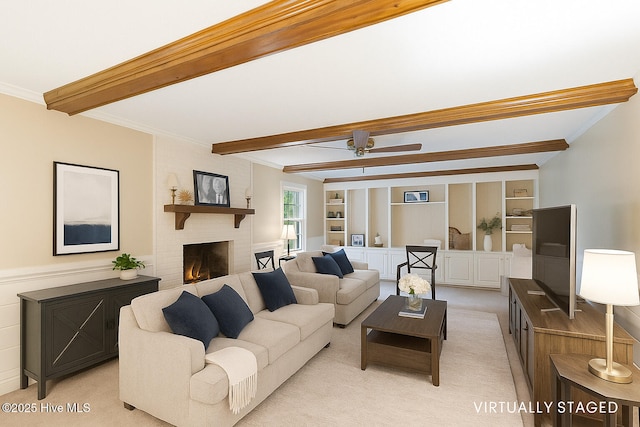 5025 Netherwood Rd, Rocky Mount, NC 27803 - living room featuring beam ceiling, ornamental molding, light colored carpet, a fireplace, and ceiling fan