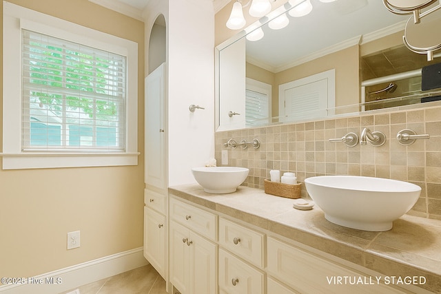 5025 Netherwood Rd, Rocky Mount, NC 27803 - full bathroom with ornamental molding, double vanity, tile patterned flooring, and a shower