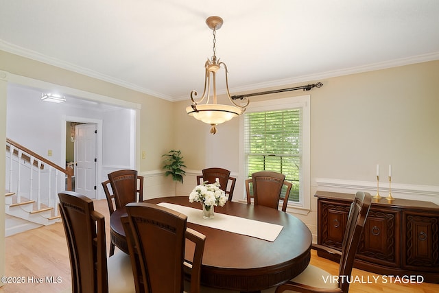 5025 Netherwood Rd, Rocky Mount, NC 27803 - dining room with light wood-style floors, ornamental molding, and stairs