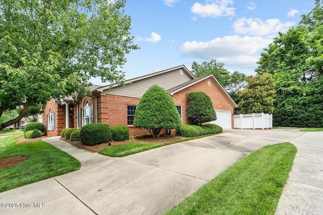 4465 Orchard Knob Ln, High Point, NC 27265 - view of front of home with brick siding, concrete driveway, and an attached garage