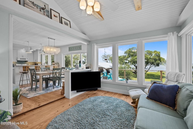 210 Upchurch Dr, Newport, NC 28570 - living area with a ceiling fan, wood ceiling, light wood-type flooring, and a chandelier