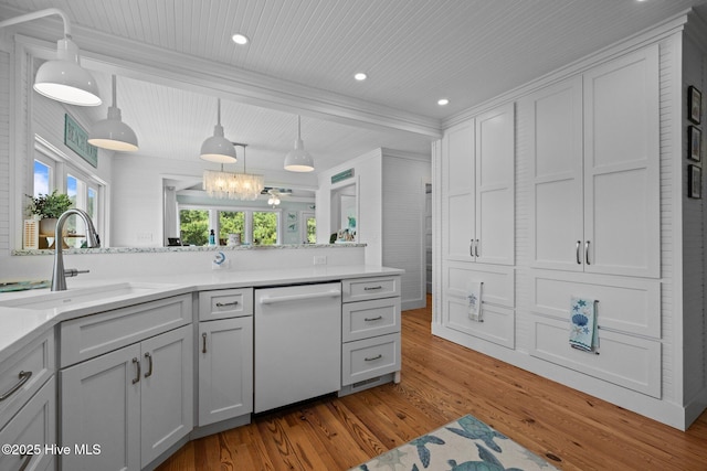 210 Upchurch Dr, Newport, NC 28570 - kitchen featuring dishwasher, light wood-type flooring, light countertops, hanging light fixtures, and a wood ceiling with exposed beams