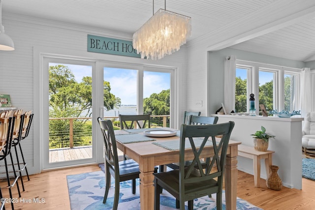 210 Upchurch Dr, Newport, NC 28570 - dining space with a chandelier and light wood-style flooring