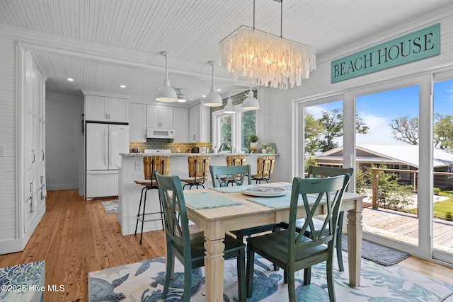 210 Upchurch Dr, Newport, NC 28570 - dining area featuring a chandelier, light wood-style floors, and recessed lighting